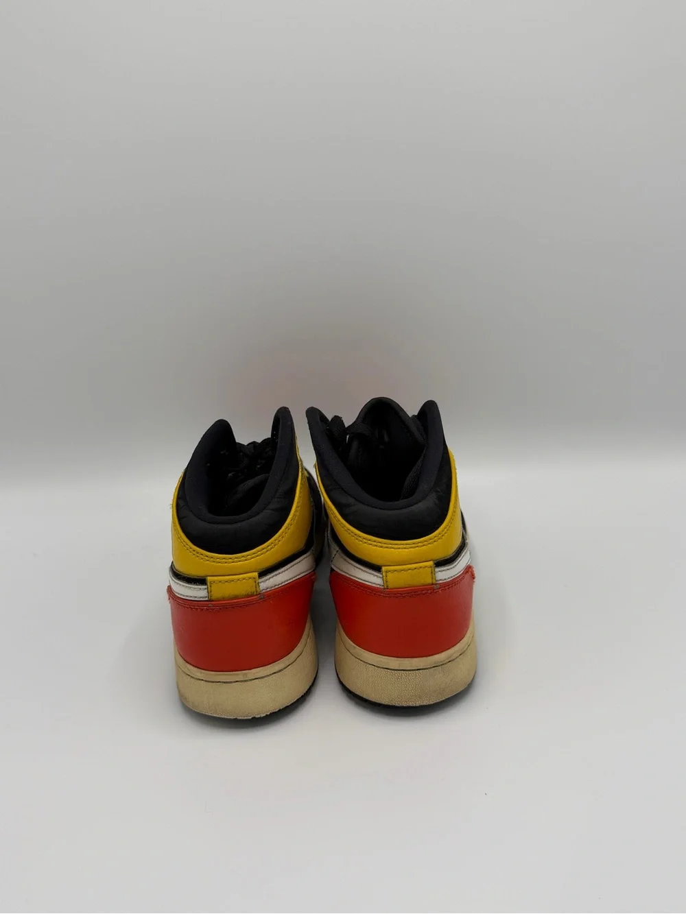 Jordan High-Top Sneakers in Black, Red & Yellow